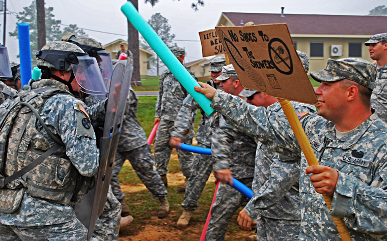 Soldiers simulating an angry mob
