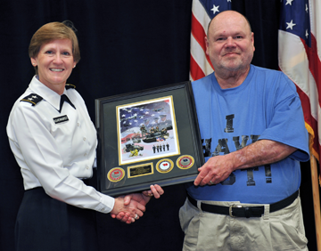 Maj. Gen. Deborah A. Ashenhurst (left), Ohio adjutant general, presents Hank Downs, a survivor of Military Sexual Trauma (MST), with a commemorative Ohio National Guard print 