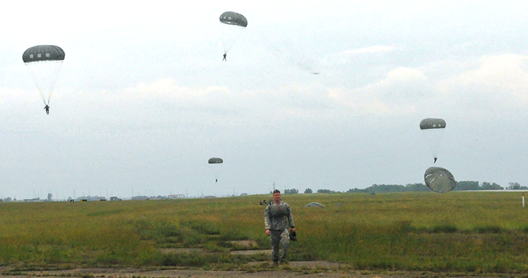 Members of the Ohio Army National Guard’s Company B, 2nd Battalion, 19th Special Forces Group (Airborne) maneuver for a landing after jumping from more than 1,000 feet, June 8, 2014, at Rickenbacker Air National Guard Base in Columbus, Ohio. More than 30 members of the Special Forces unit were conducting a jump into the drop zone at Rickenbacker as part of their weekend drill training.