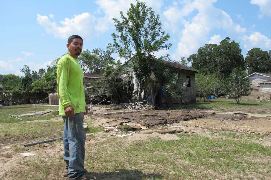 Texas local stands in front of devastated area in Austin Texas.