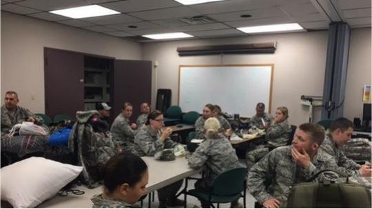 Airmen waiting in classroom for deployment.