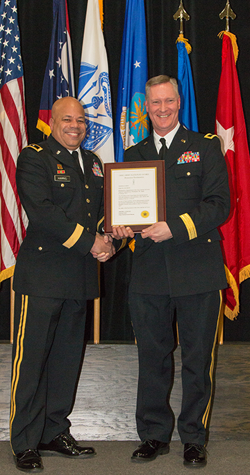 Maj. Gen. John C. Harris Jr. (left), Ohio assistant adjutant general for Army, presents the promotion order to new Brig. Gen. Steven E. Stivers.