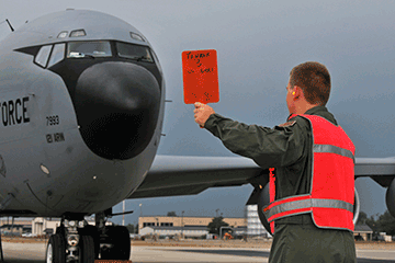 15-year-old Chase Fulmer learns to marshal a KC-135 Stratotanker .