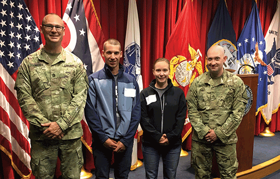 Nate and Irene Miller, husband and wife, pose with recruiters Sgt. 1st Class James Youngdahl (left) and Sgt. Noah Siegner after enlisting together into the Ohio Army National Guard May 25, 2018, at the Military Entrance Processing Station in Cleveland. The couple, married for four years, enlisted together into the Ohio Army National Guard and are scheduled to go to basic training in October, and will be assigned to the 1484th Transportation Company, based in North Canton, Ohio.