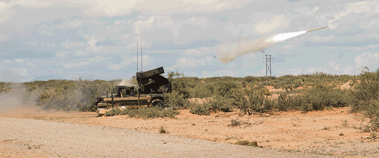 An Avenger Weapon System fires at a live-fire short-range missile range.