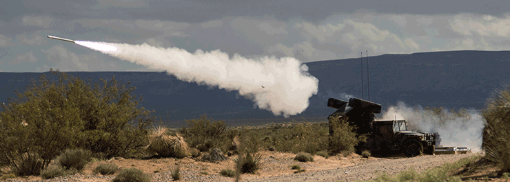 An Avenger Weapon System fires at a live-fire short-range missile range.