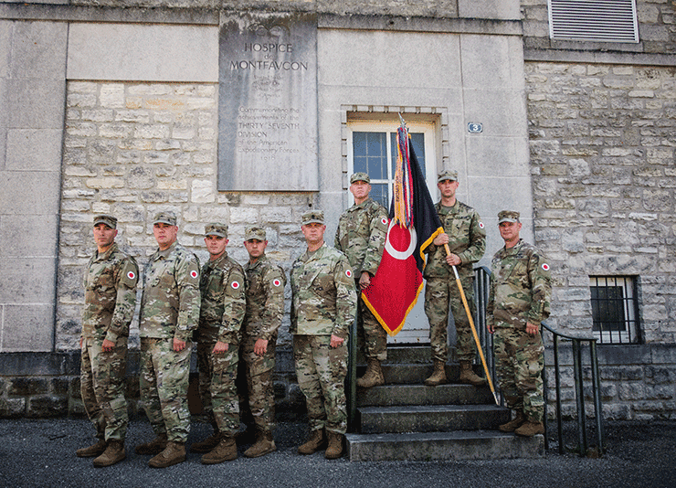 Soldiers from the 37th Infantry Brigade Combat Team, Ohio Army National Guard stand in front of the Hospice de Montfaucon in Montfaucon, France.
