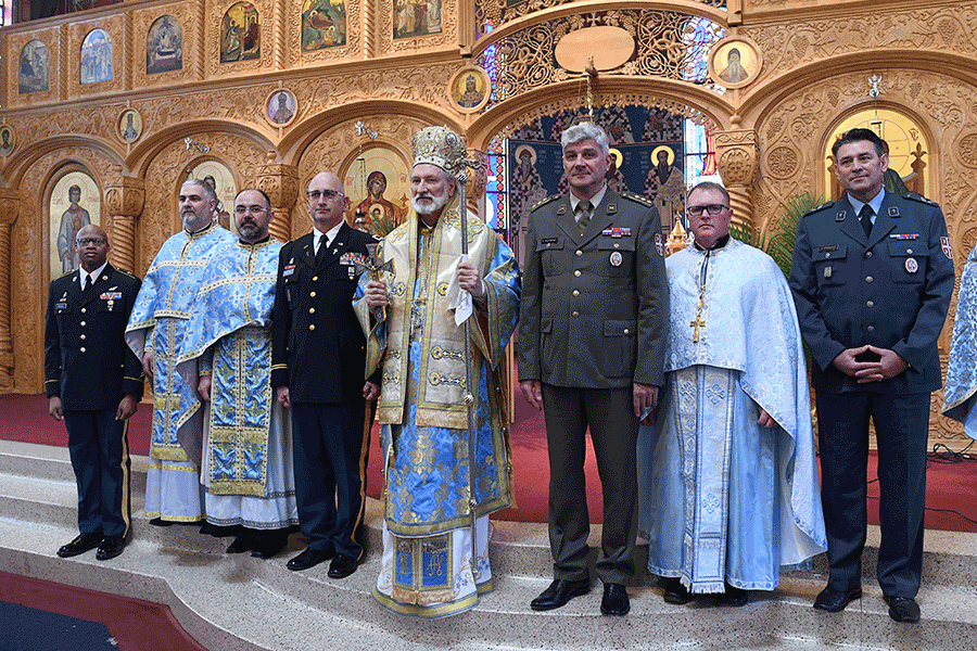 Members of the Serbian Armed Forces stand in front of altar in Cathedral.