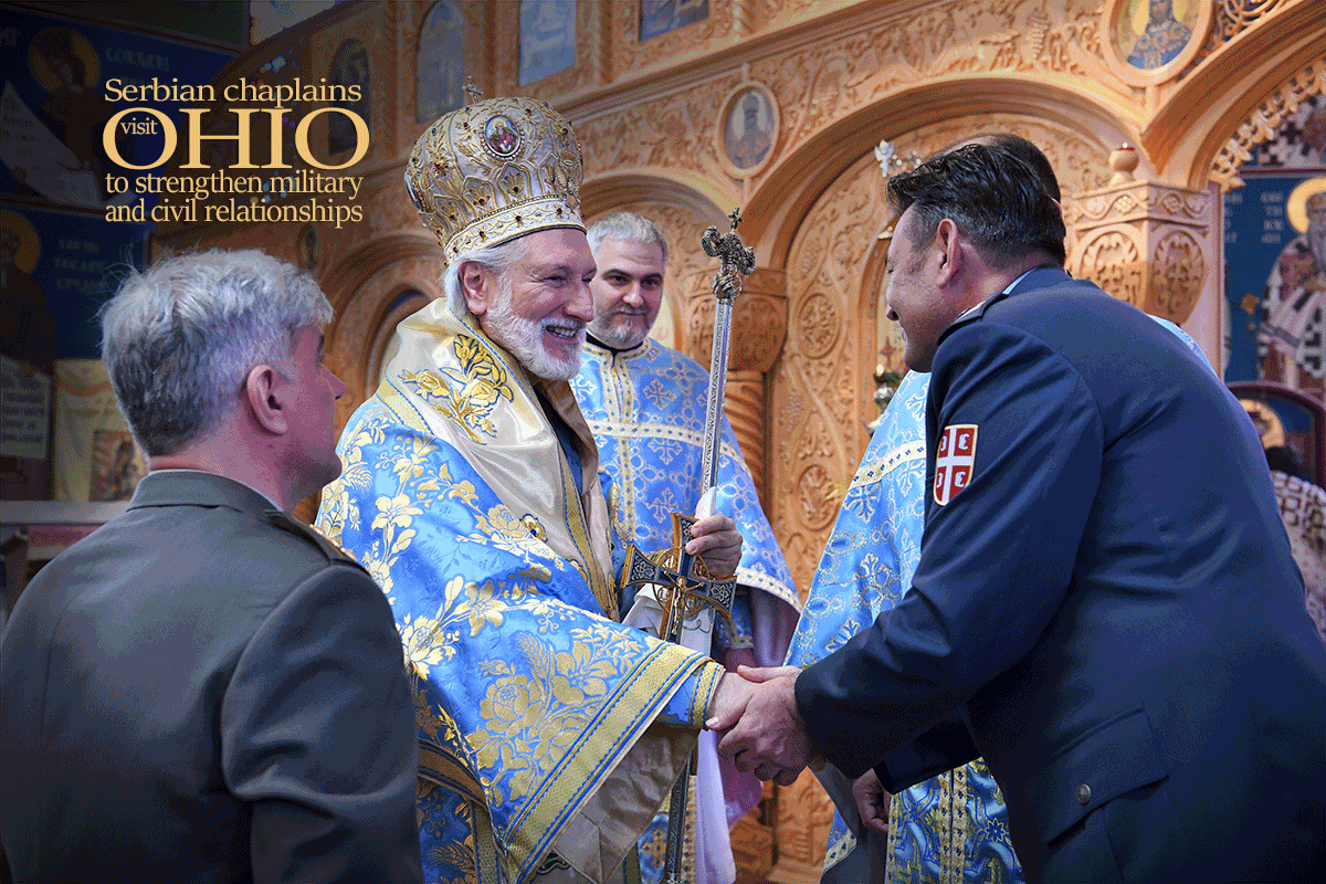 Serbian army Col. receives communion from Bishop Irinej in Cathedral.