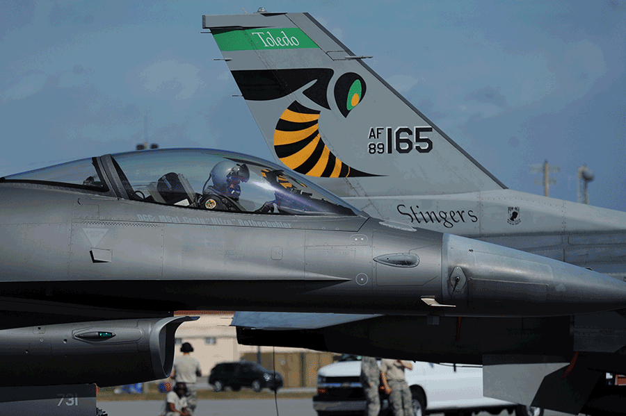 Pilot inside F-16 on tarmak, alonside another F-116 for AF165 - Stingers.
