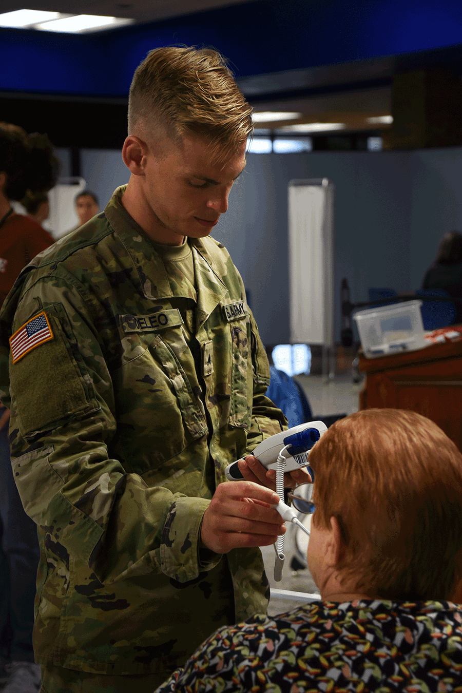 An Ohio Army National Guard health care specialist takes a patient’s vitals.