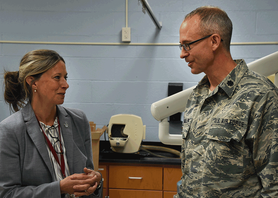 Dr. Amy Acton talking with Lt. Col. Timothy Stuhlmiller.