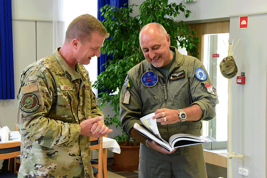Hungarian Brig. Gen. Nándor Kilián presents a book to U.S. Air Force Brig. Gen. Todd Audet.