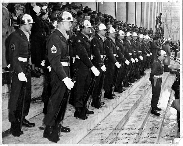 Black and white photo of Ohio National Guardsmen standing in row from the side of the steps to Ohio capital building.
