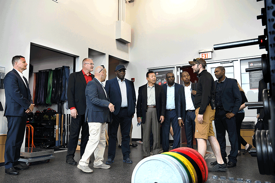 Delegation tours a weight room.