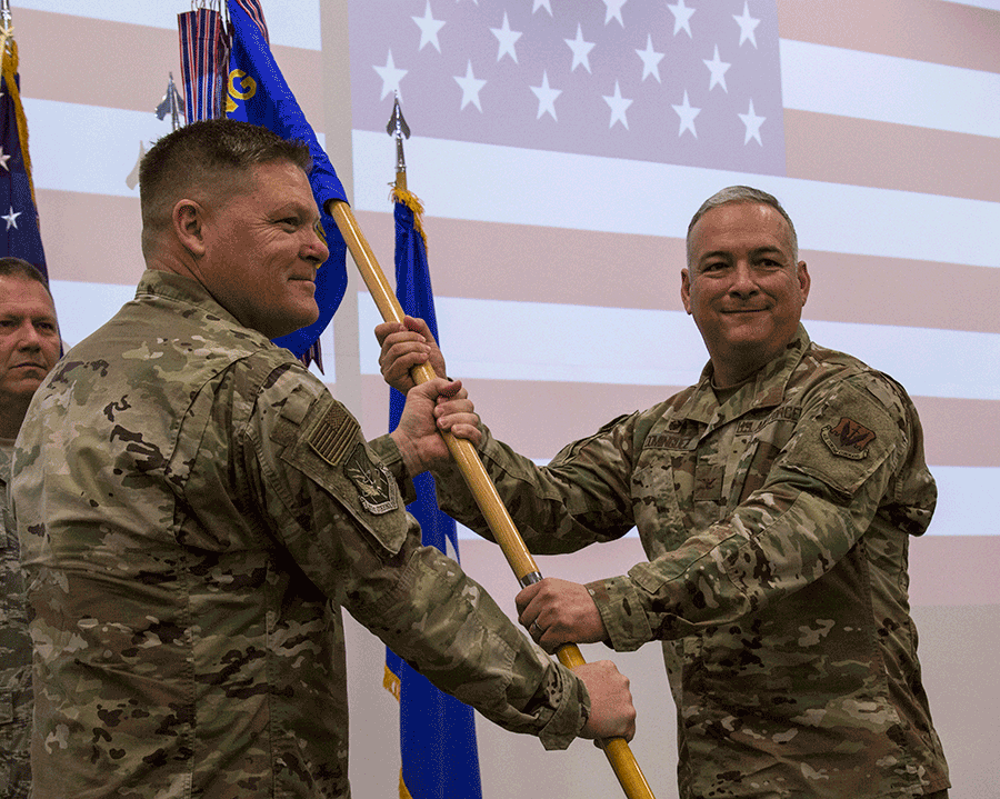 Col. Francisco J. Dominguez receives the unit guidon from Brig. Gen. James R. Camp.