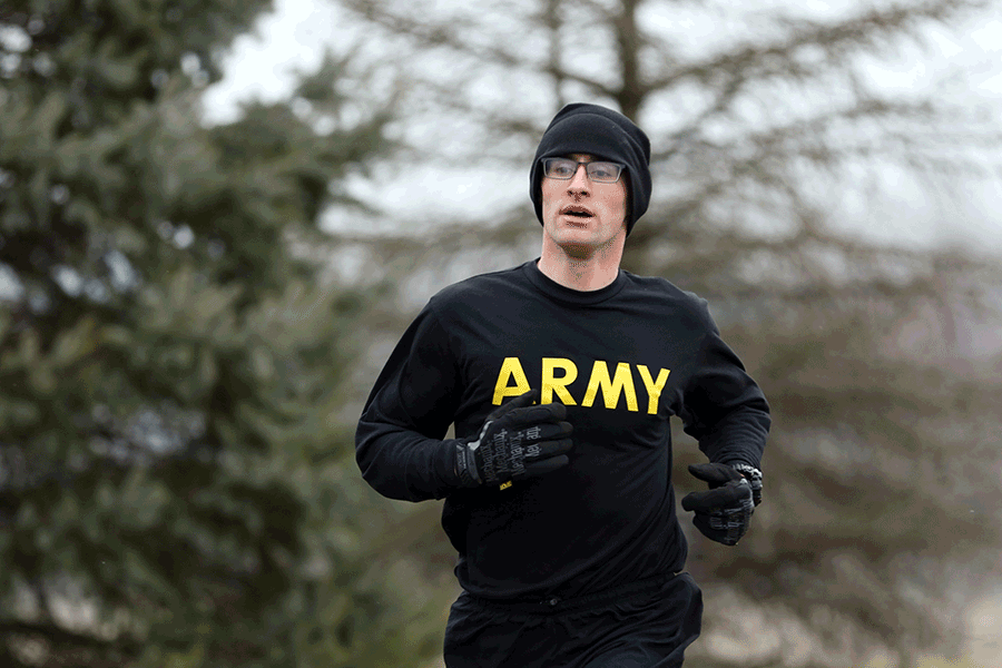 Soldier running in ARMY long-sleeve t.
