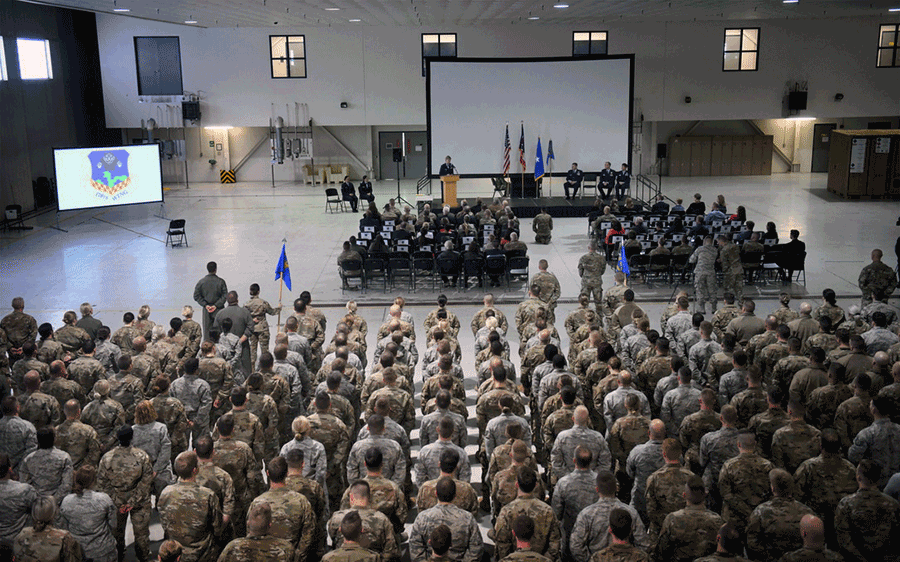 Change of command ceremony viewed from the back of the hangar.