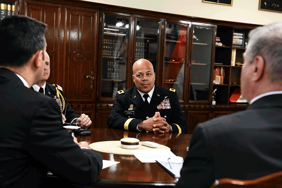 Maj. Gen. John C. Harris Jr. at table with Hungaririan leadership.
