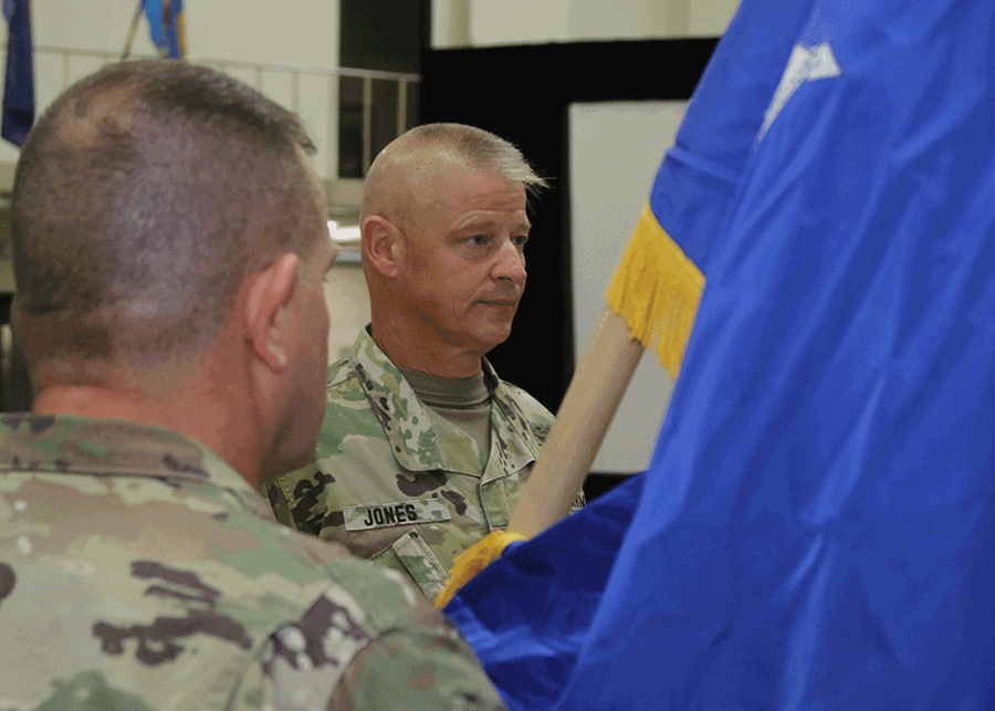 Command Sgt. Maj. Rodger M. Jones prepares to pass the colors.
