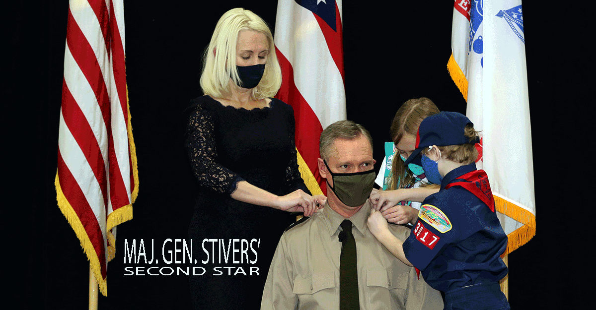 Wife, son and daughter pin second star on Maj. Steve Stiver's shoulder epaulettes.