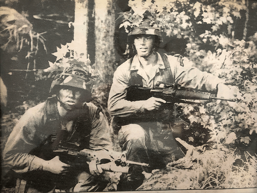 Then-Pfc. William Workley conducts a patrol with fellow Soldier.