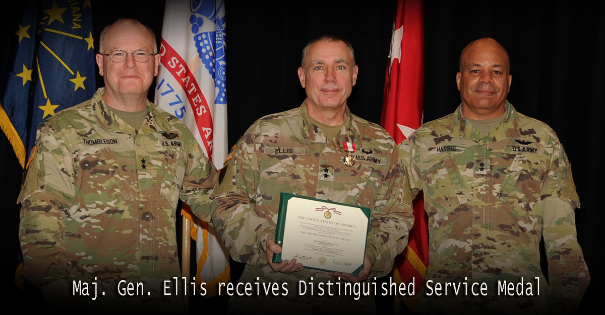 Ellis holds certificate standing up with leadership.
