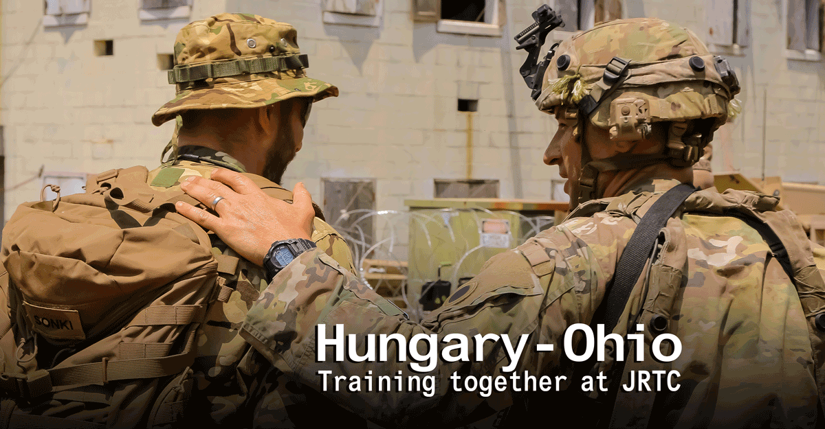 An Ohio National Guard Soldier pats Hungarian Defence Forces memberon the back. 