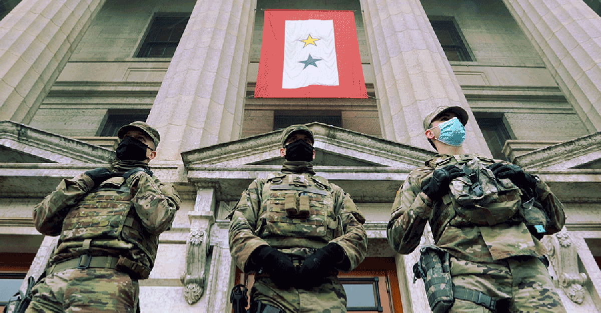 Three guard members guard steps of the Ohio Statehouse.