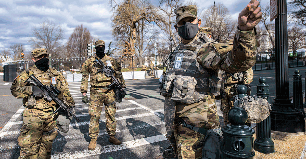 Three guard members guard streets in the capital area.