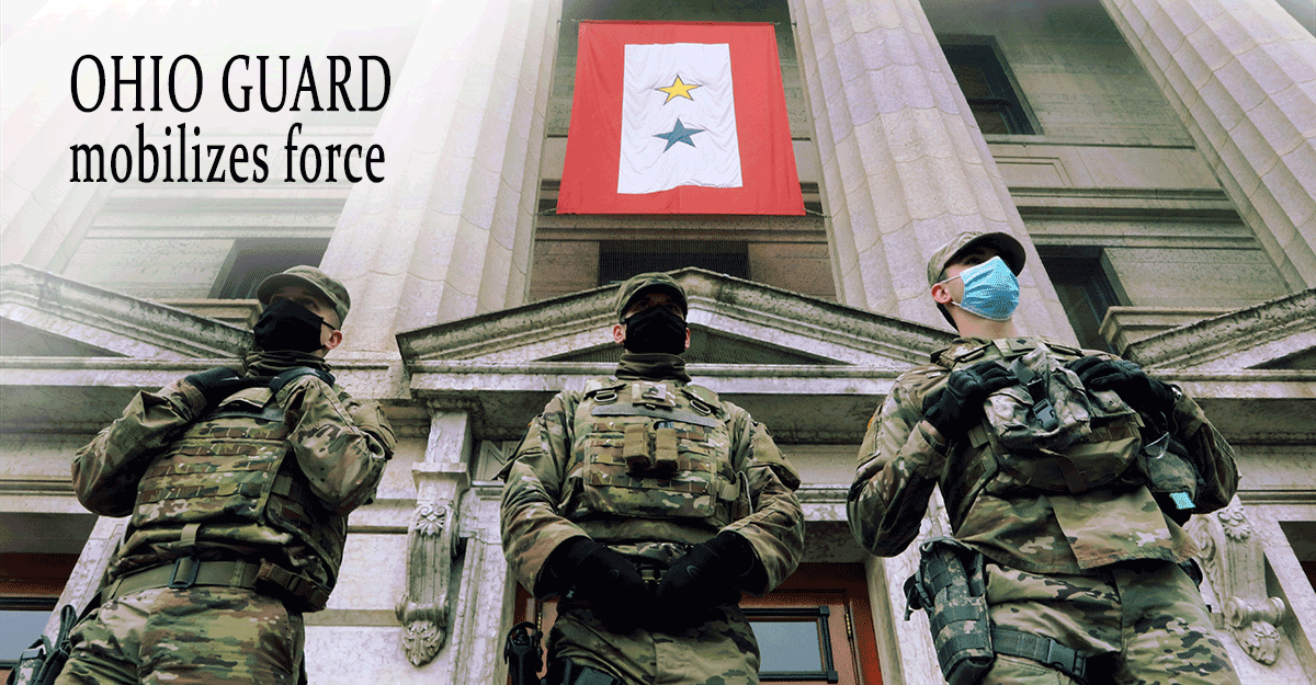 3 Guard Members in front of state capital doors.
