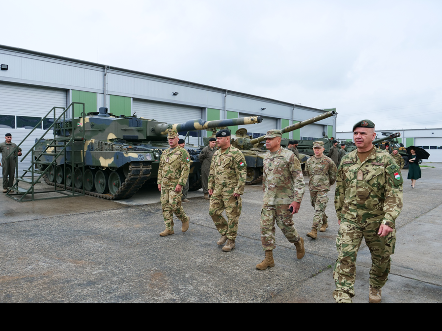 Soldiers touring tank facility.