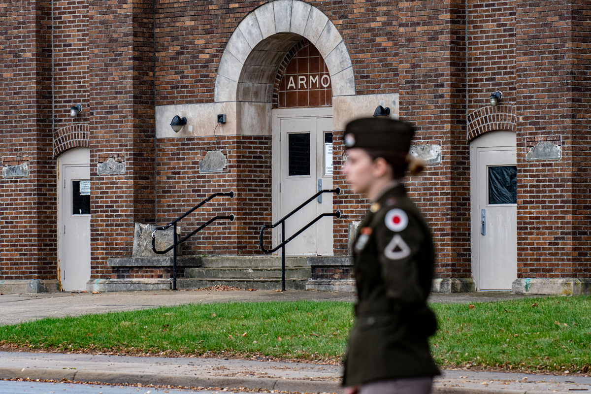 Soldier passes by armory