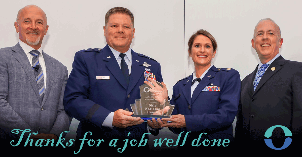2 men pose with ATAG for air and female airman holding award