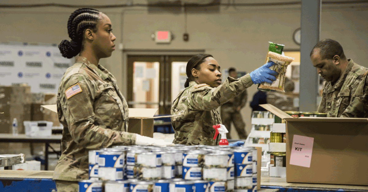 Soldiers load boxes at food bank