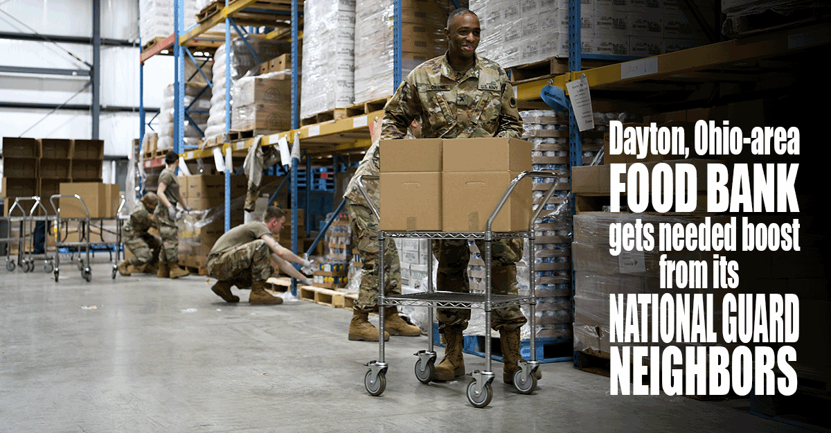 Soldiers working in food pantry warehouse.