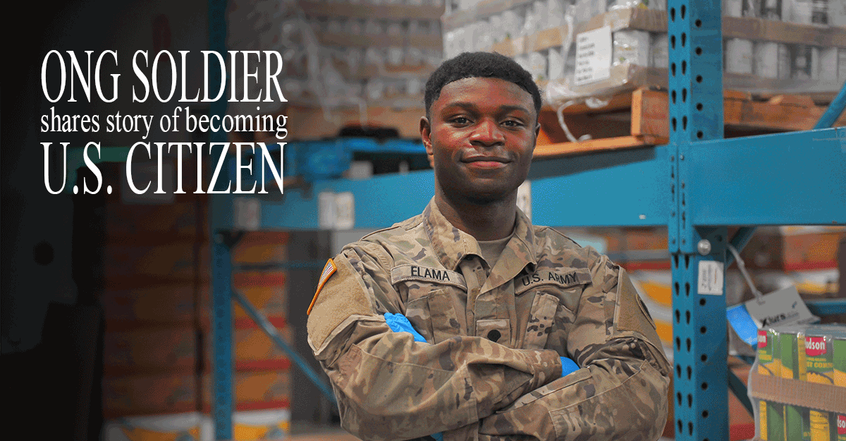Spc. Jacque Elama stands in warehouse