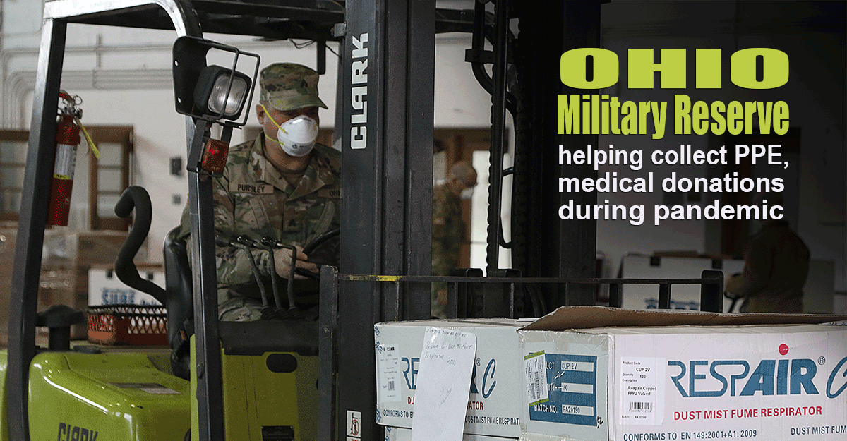 Soldier moves boxes of PPE with forklift.
