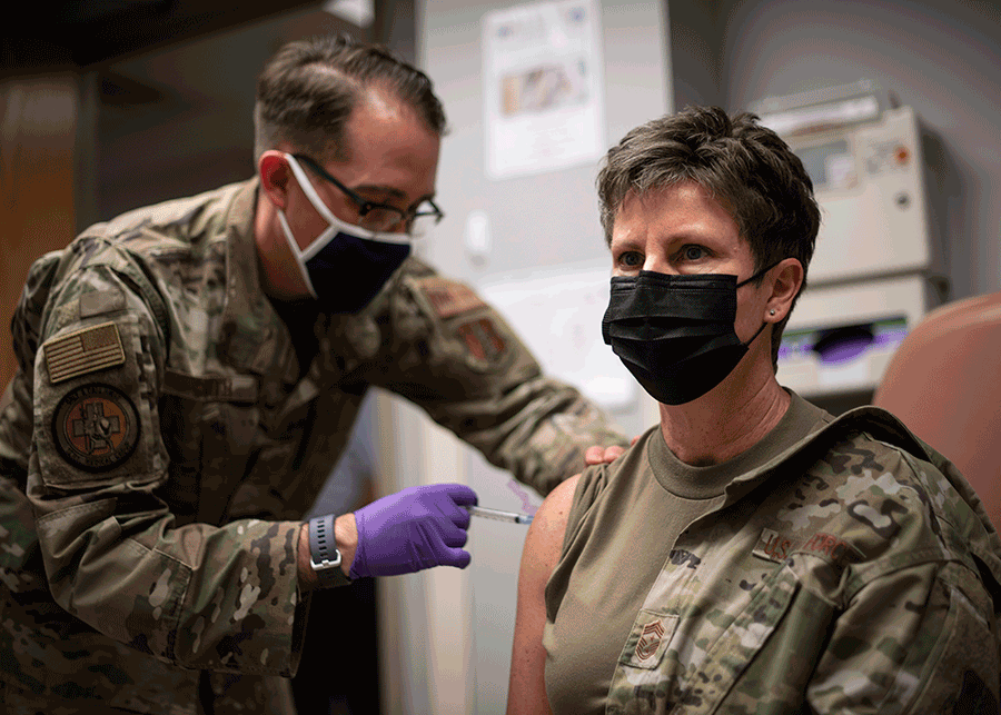 Chief Master Sgt. Heidi Bunker receives vaccine.