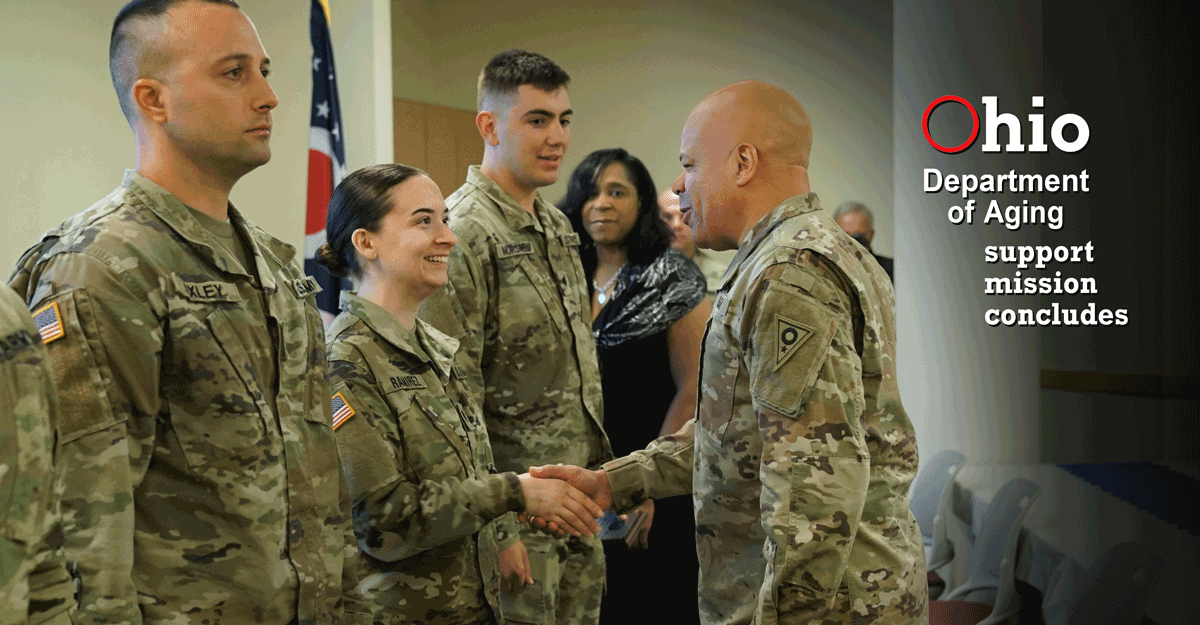 Maj. Gen. John C. Harris Jr. shakes hands wtith a group of Ohio National Guard members