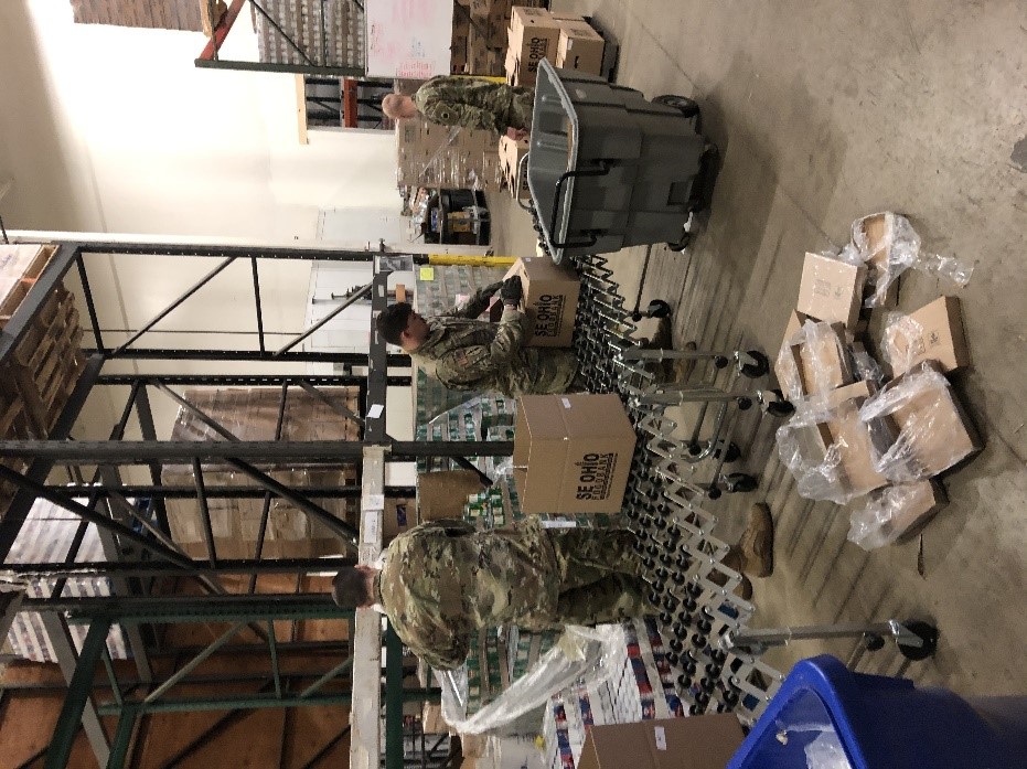 Soldier packaging individual meal kits.
